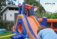 Girl on inflatable slide fail