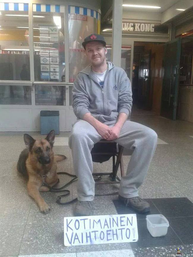 Kotimainen vaihtoehto - kuva on otettu Helsingissä, Malmilla. Mies istui koiransa kanssa läpikulkutunnelissa, joka on paikkana tunnettu siitä, että siellä on paljon romaninkerjäläisiä ja mies menin heidän alueelleen kerjäämään. kuva on otettu 1.7.2014.