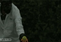 Hitting tennis ball on fire in slow-motion